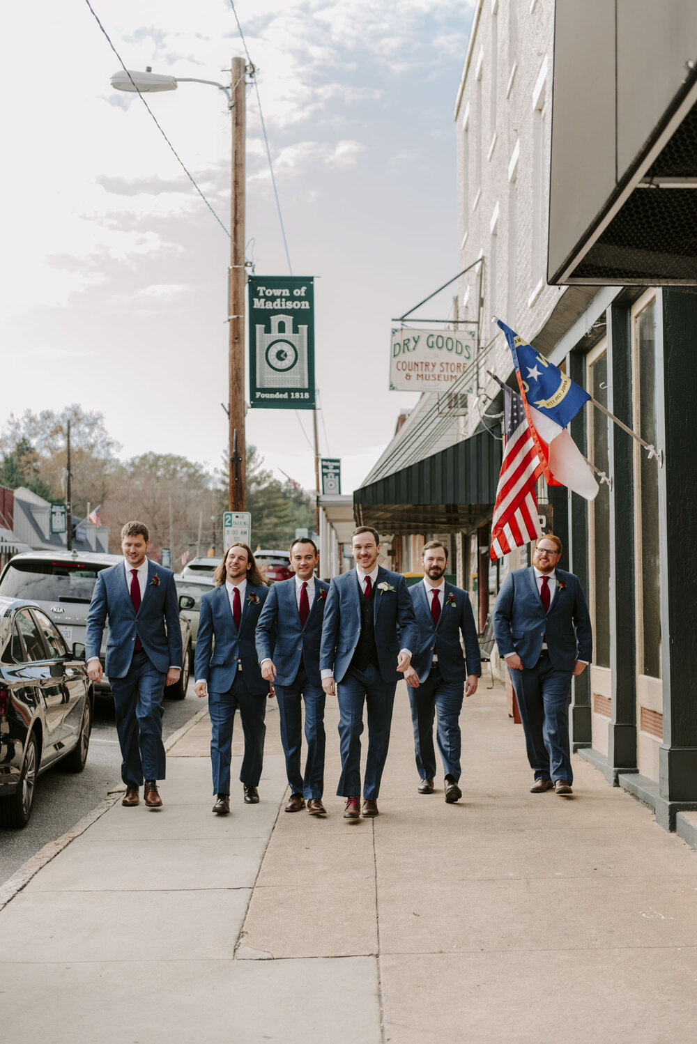 Groom and groomsmen walking portraits at fall wedding in Winston-Salem, NC