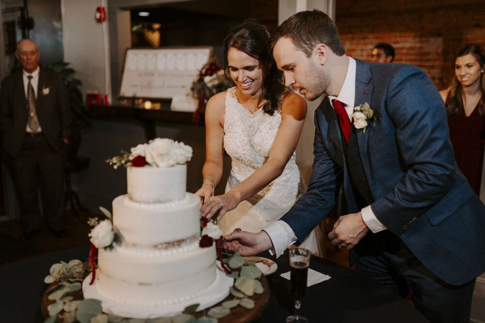 Cake cutting at fall wedding in Winston-Salem, NC