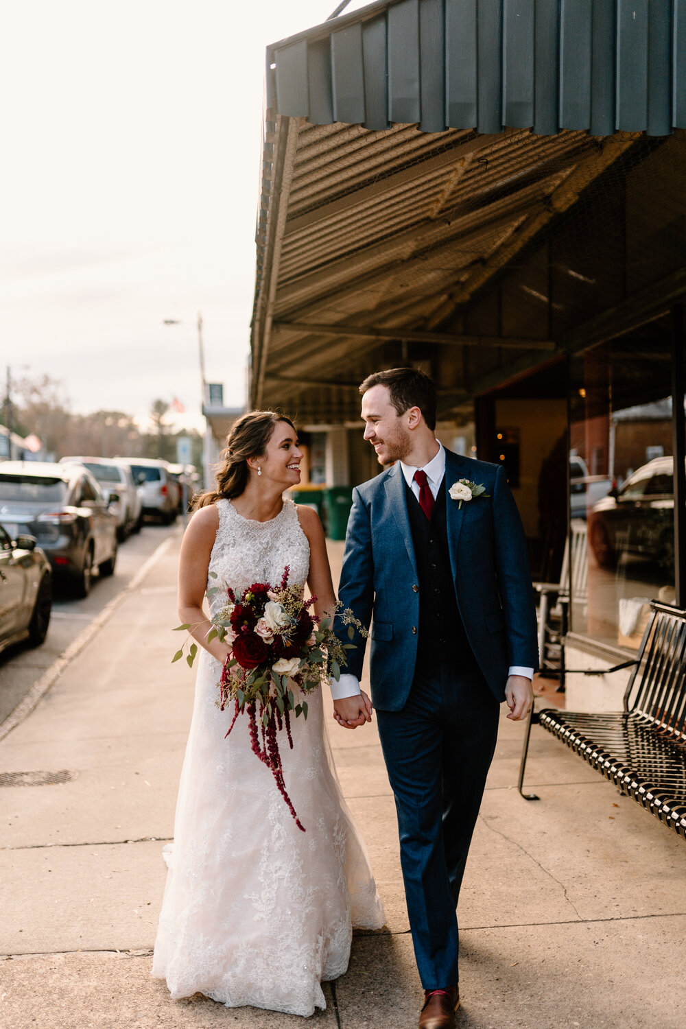 Newlywed portraits in rustic downtown Madison, NC on fall wedding day
