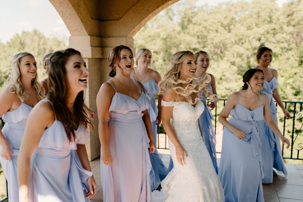 bride and bridemaids getting ready and having fun by Kayli LaFon Photography