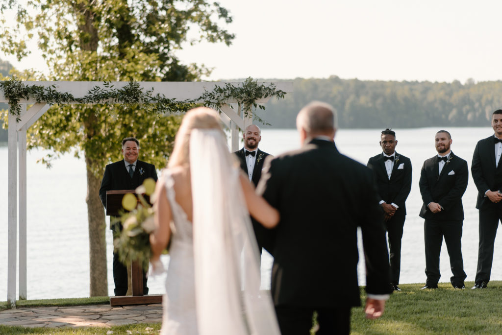Groom looking at bride during wedding ceremony in Greensboro North Carolina | by Kayli LaFon Photography