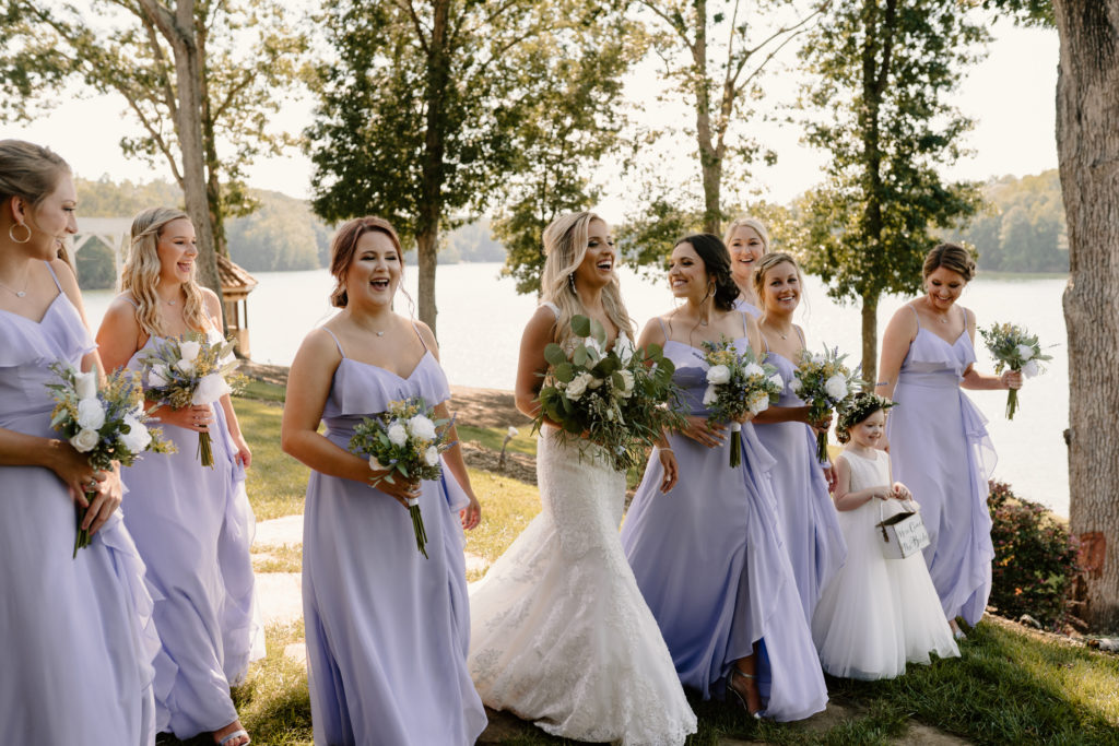 Bride and Bridesmaids laughing for their portraits by Kayli LaFon Photography