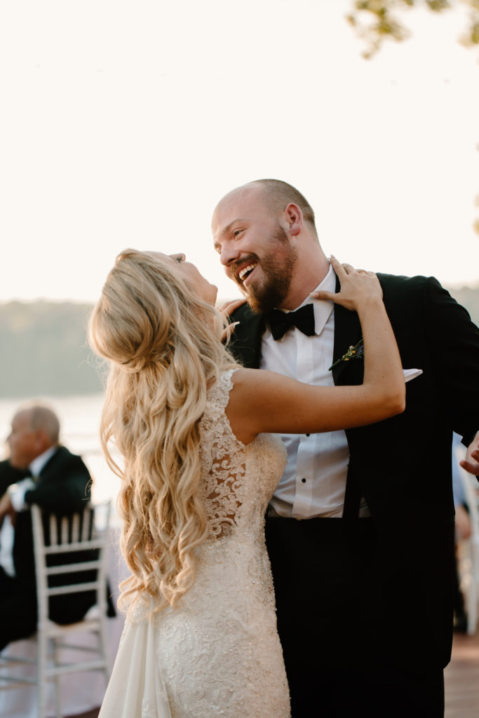 Bride and groom laughing during the first dance by Kayli LaFon Photography