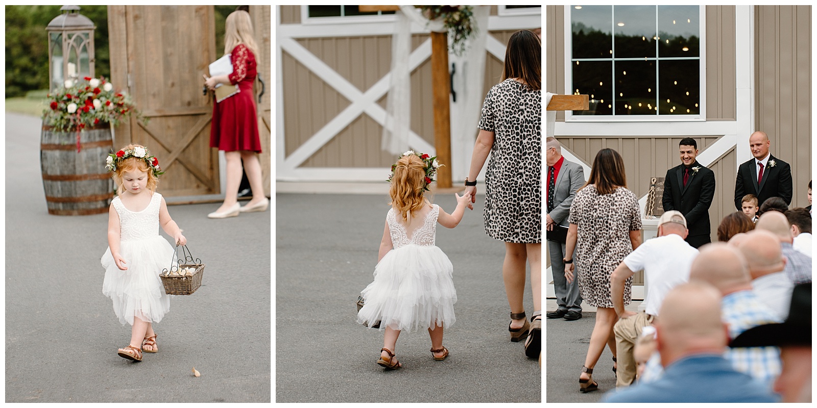 Redheaded young flower girl with tulle skirt throws white rose pedals as she walks down the aisle, gets nervous, and asks her mom to hold her hand.