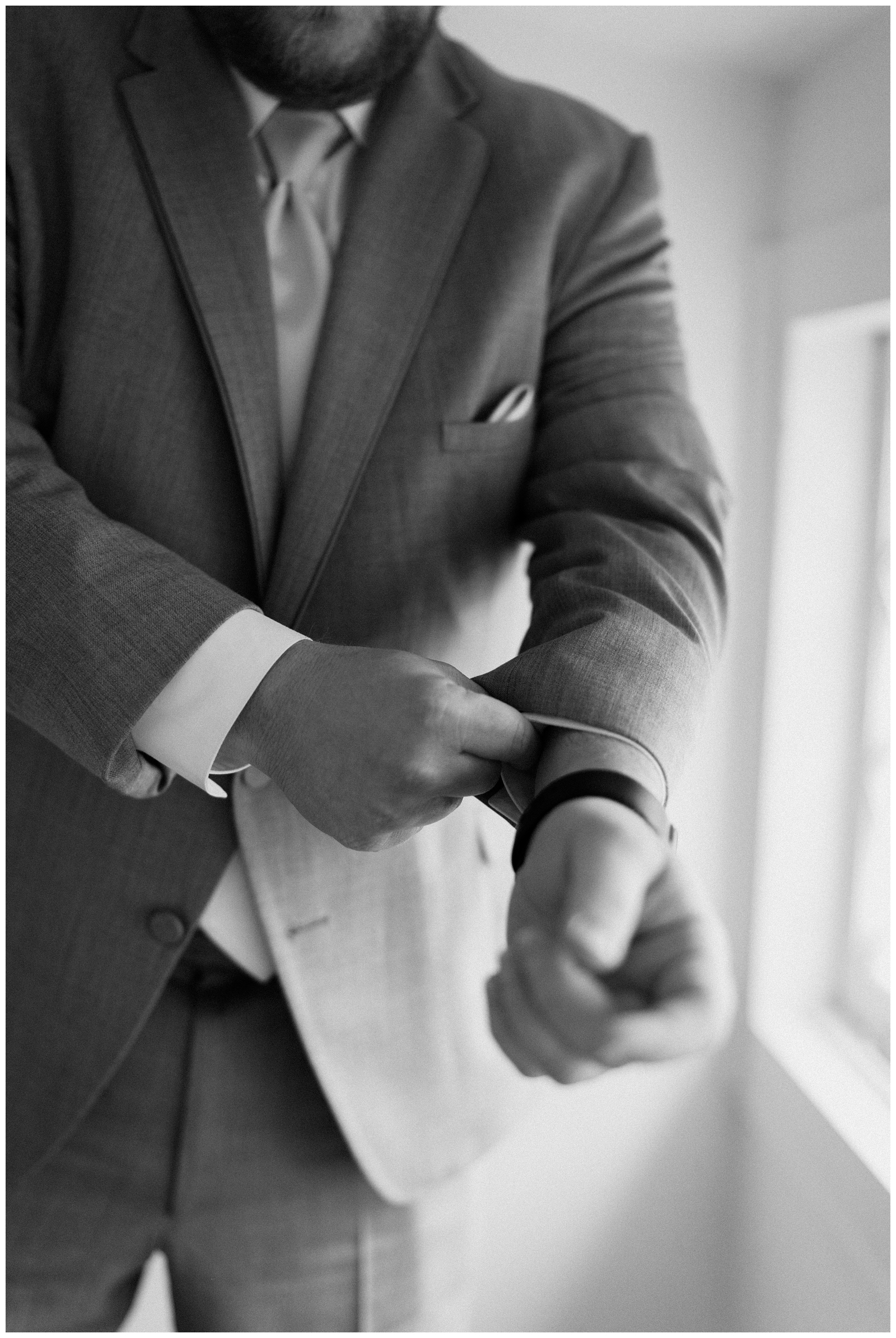 Groom getting ready at the McAlister-Leftwich House in downtown Greensboro by NC wedding photographer