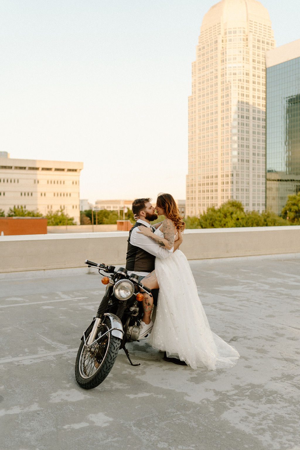 fun urban city elopement With Motorcycle on rooftop