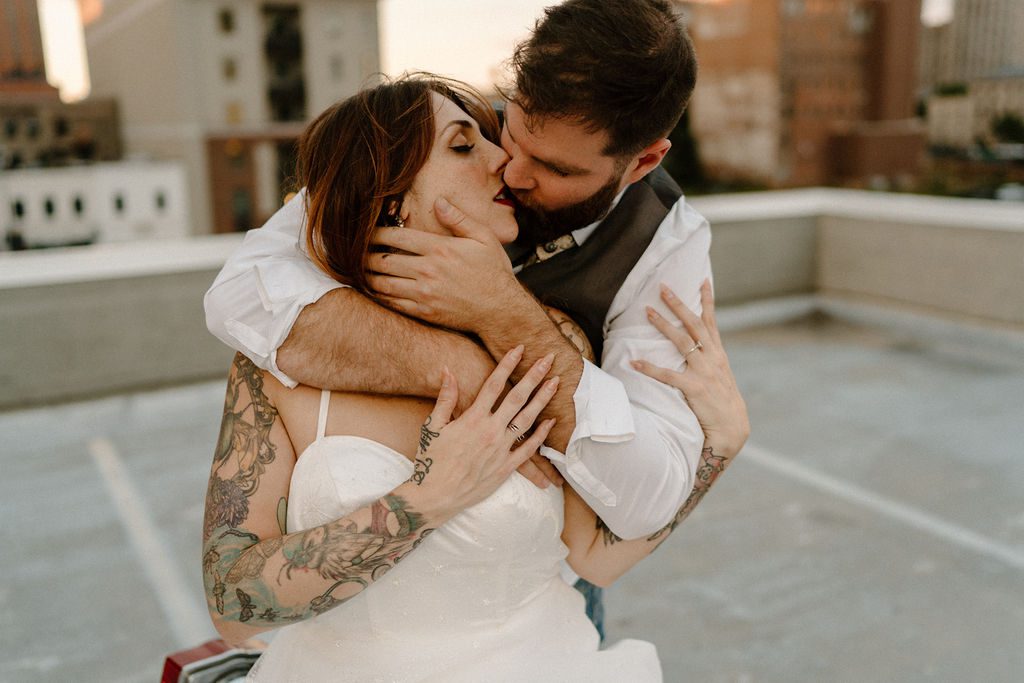 fun elopement with edgy couple on rooftop of downtown winston salem north carolina