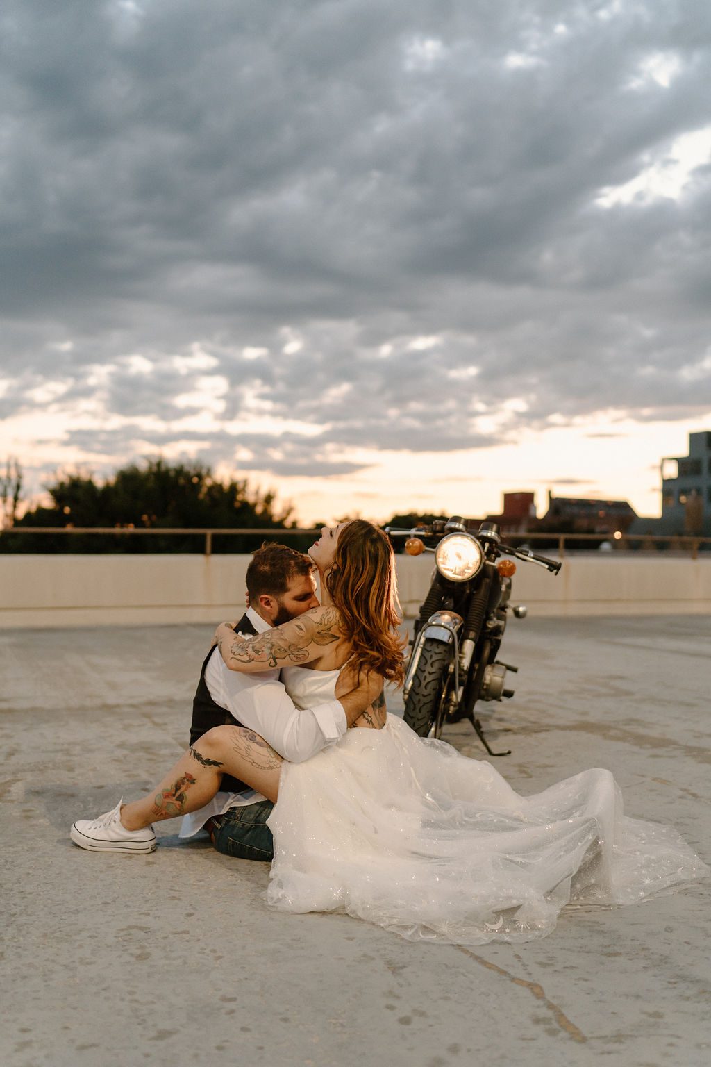 fun urban city elopement With Motorcycle on rooftop sunset in north  carolina