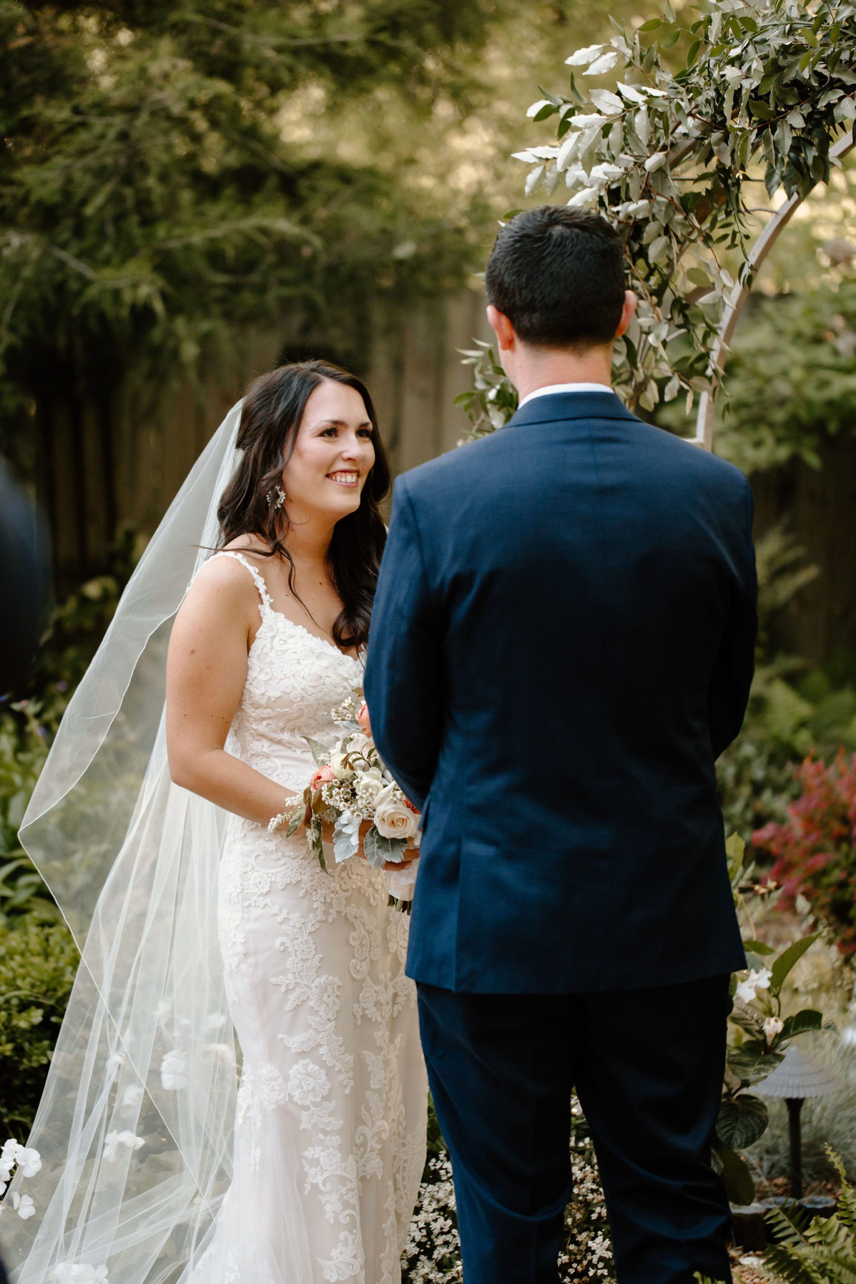 Beautiful bride and groom photos with light and airy floral arrangements and simple elegant decor 