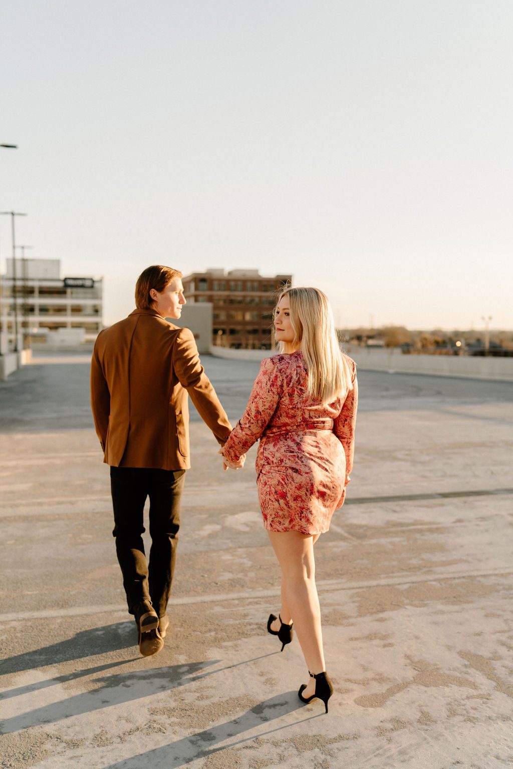 fun couple during engagement photos in city of north carolina