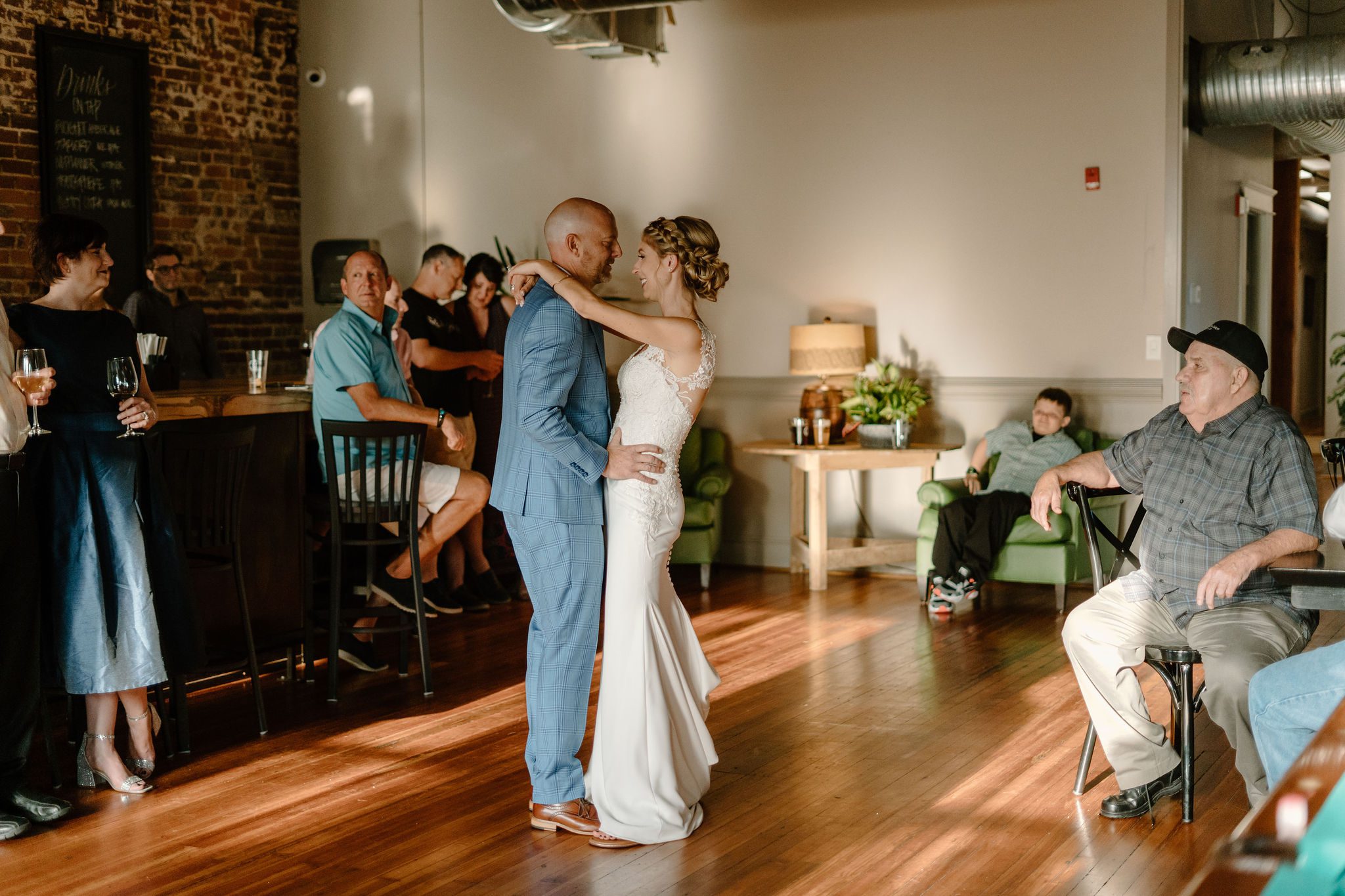 Beautiful bride and groom during  ceremony and unique reception location in Greensboro North Carolina