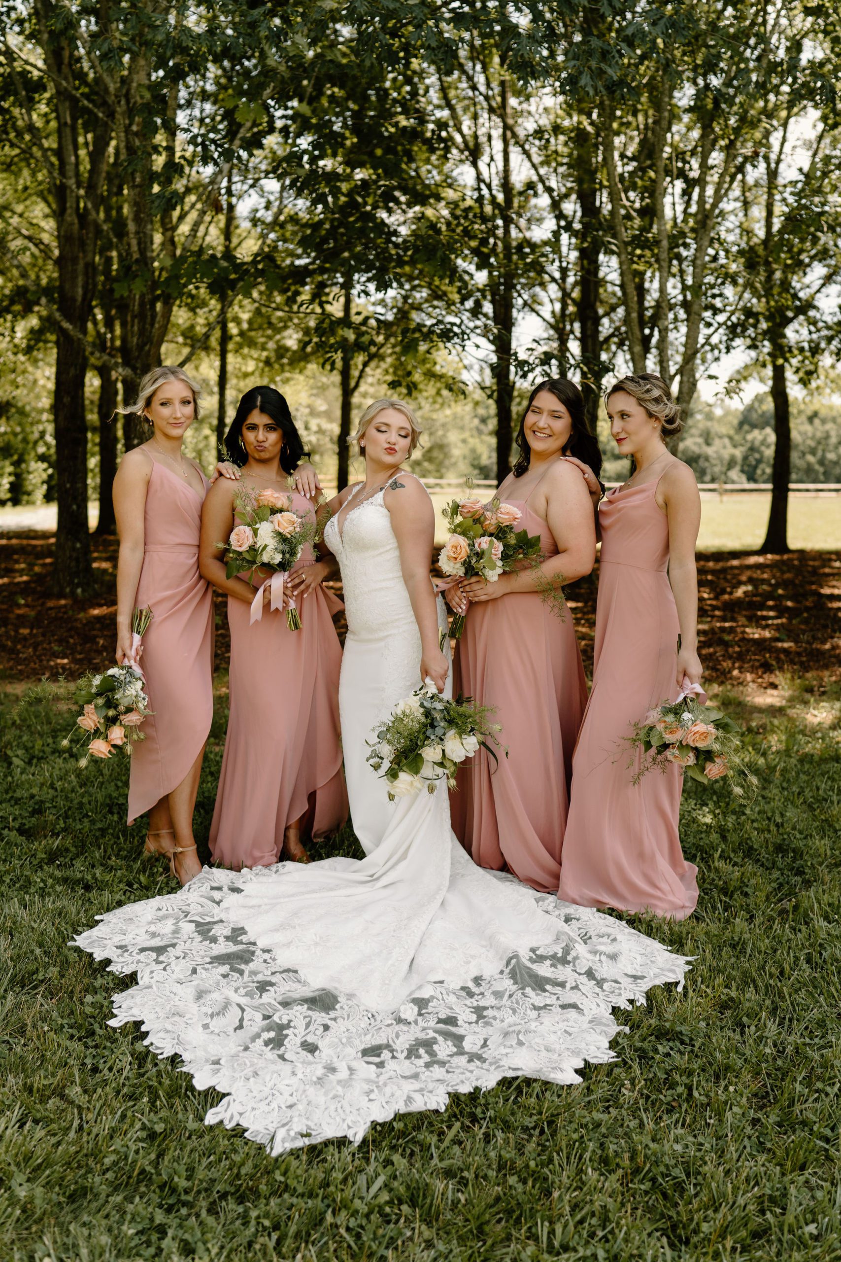 Long Acres Barn venue in Winston-Salem, North Carolina with beautiful decor and forest vibes in bridal party photos
