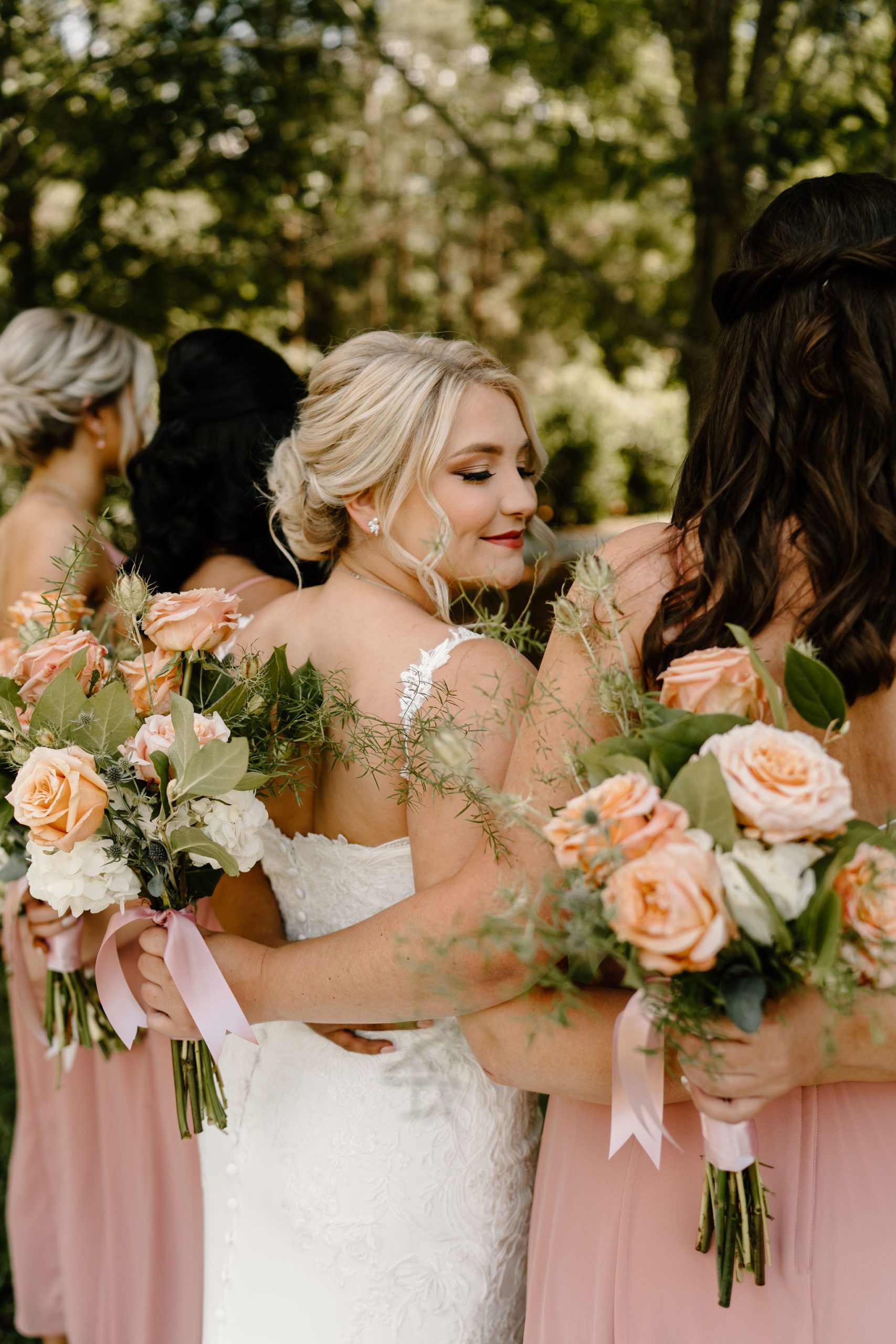 Long Acres Barn venue in Winston-Salem, North Carolina with beautiful decor and forest vibes in bridal party photos