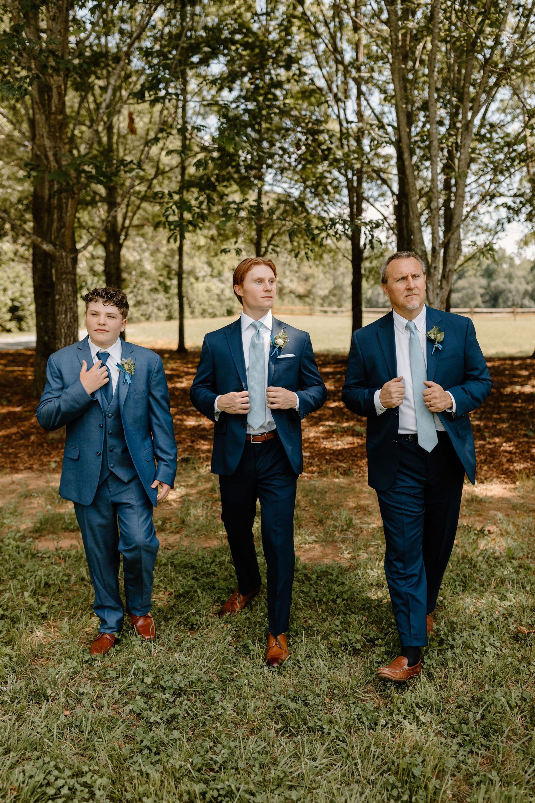 Long Acres Barn venue in Winston-Salem, North Carolina with beautiful decor and forest vibes in groomsmen photos