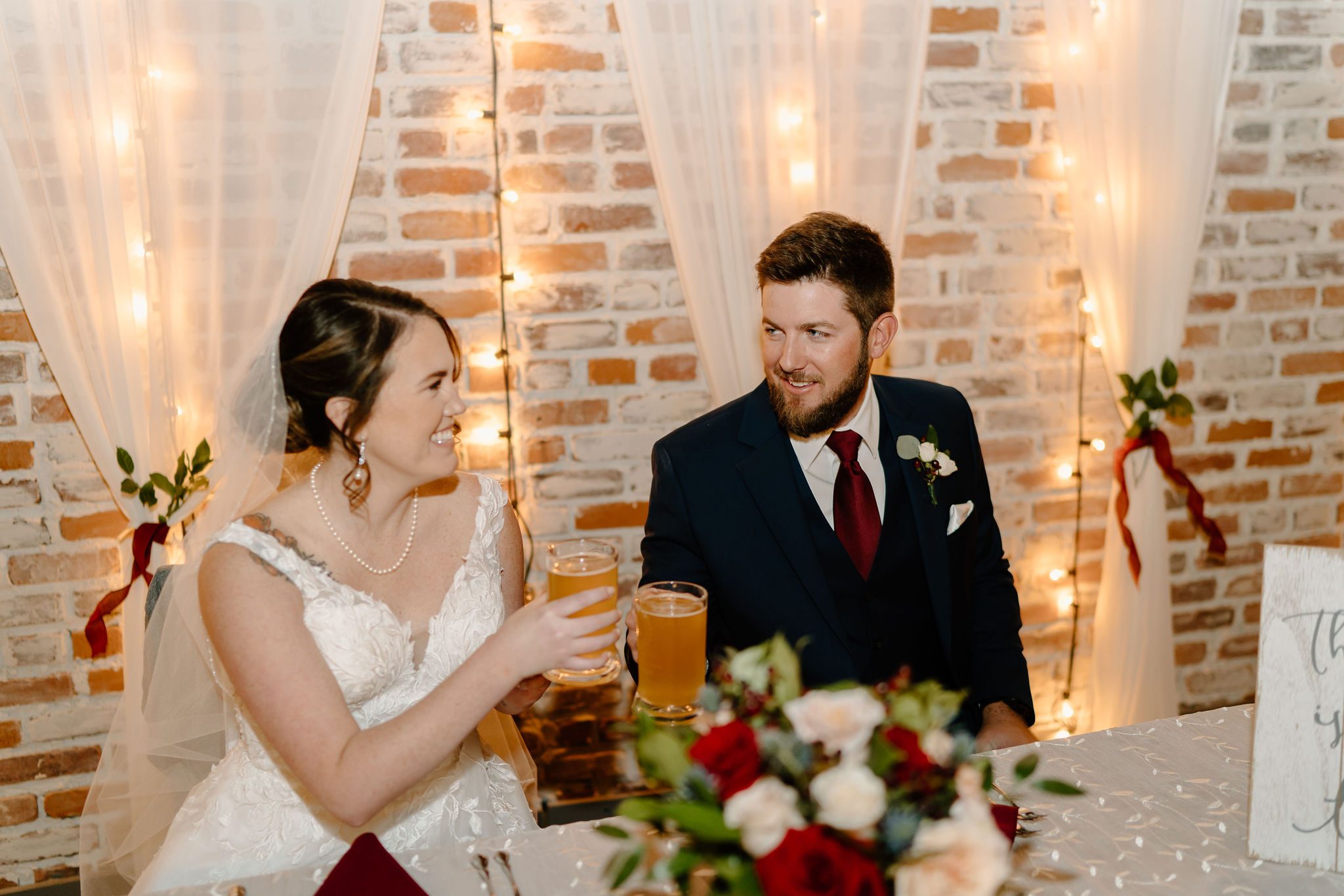 Details of Bakery 1818 venue in North Carolina during Christmas themed bride and groom photos with bridal party and friends and family
