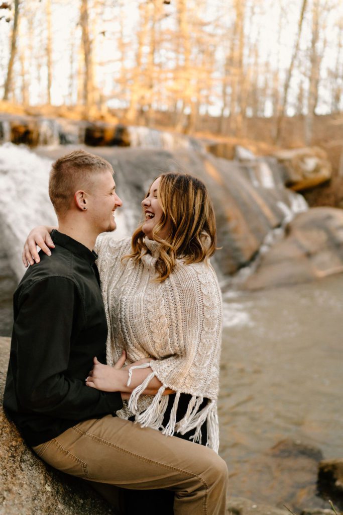 Couple laughing during photoshoot in North Carolina