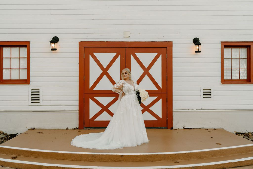 Bride poing for bridal portraits in Clemmons North Carolina at WinMock at Kinderton wedding venue