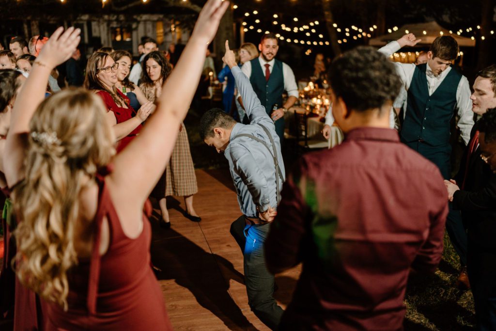 Wedding guests dancing at wedding reception