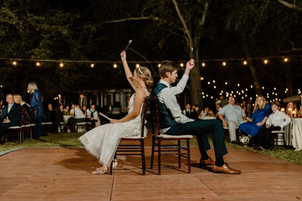 Bride and groom playing reception games