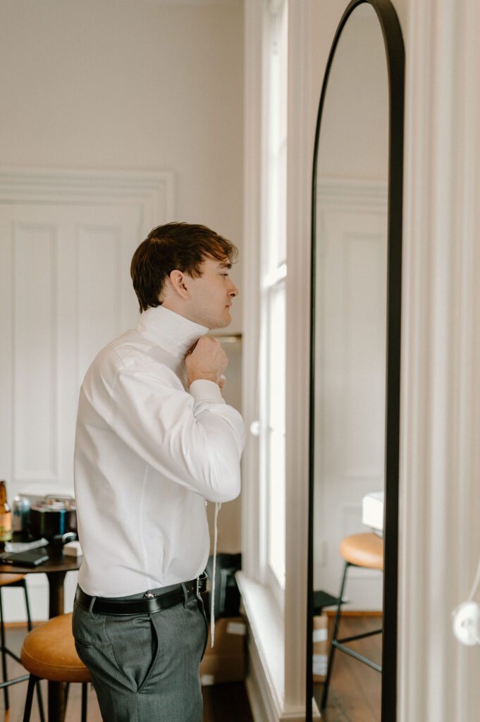 Groom getting ready for ceremony