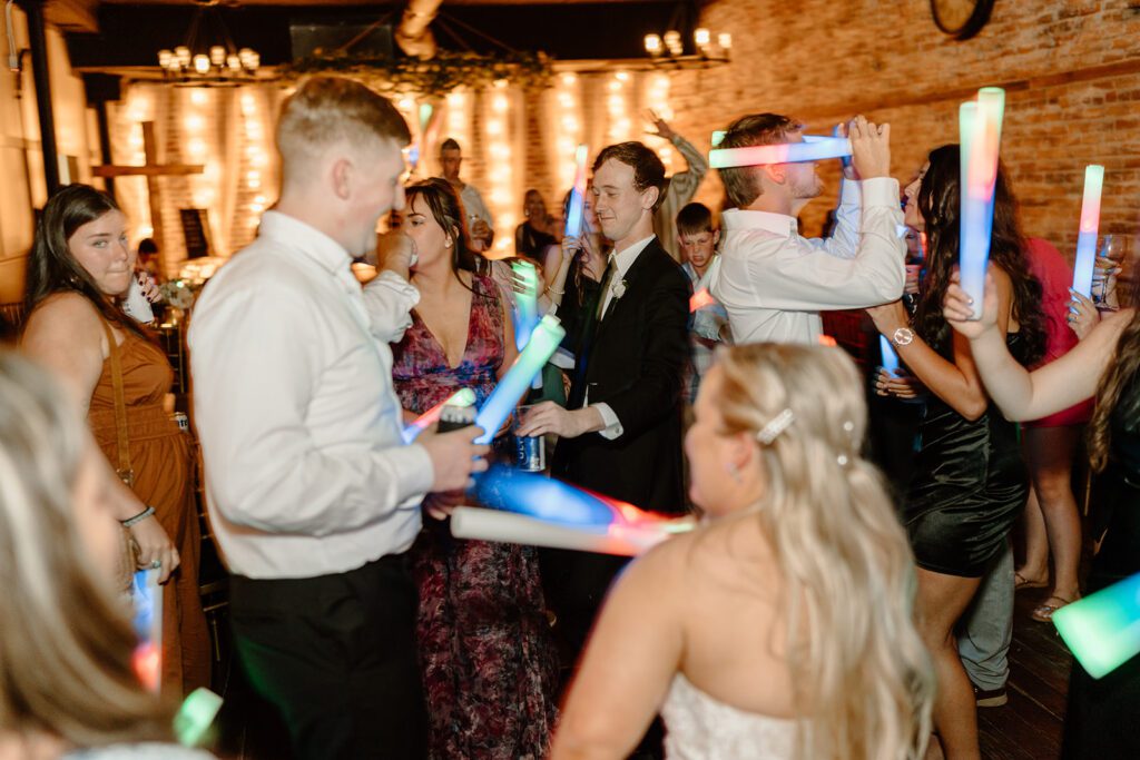 Open dancing with glowsticks at wedding