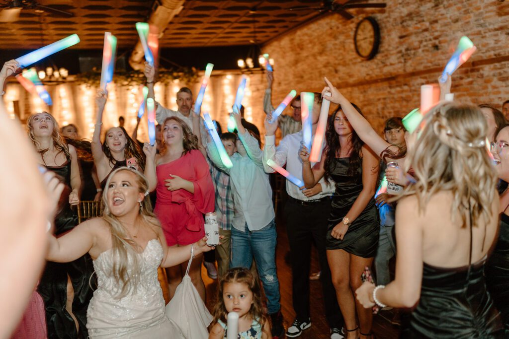 Open dancing with glowsticks at wedding